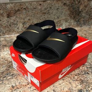 New in box Nike Kawa Slides Black w/gold swoosh Slides 10C